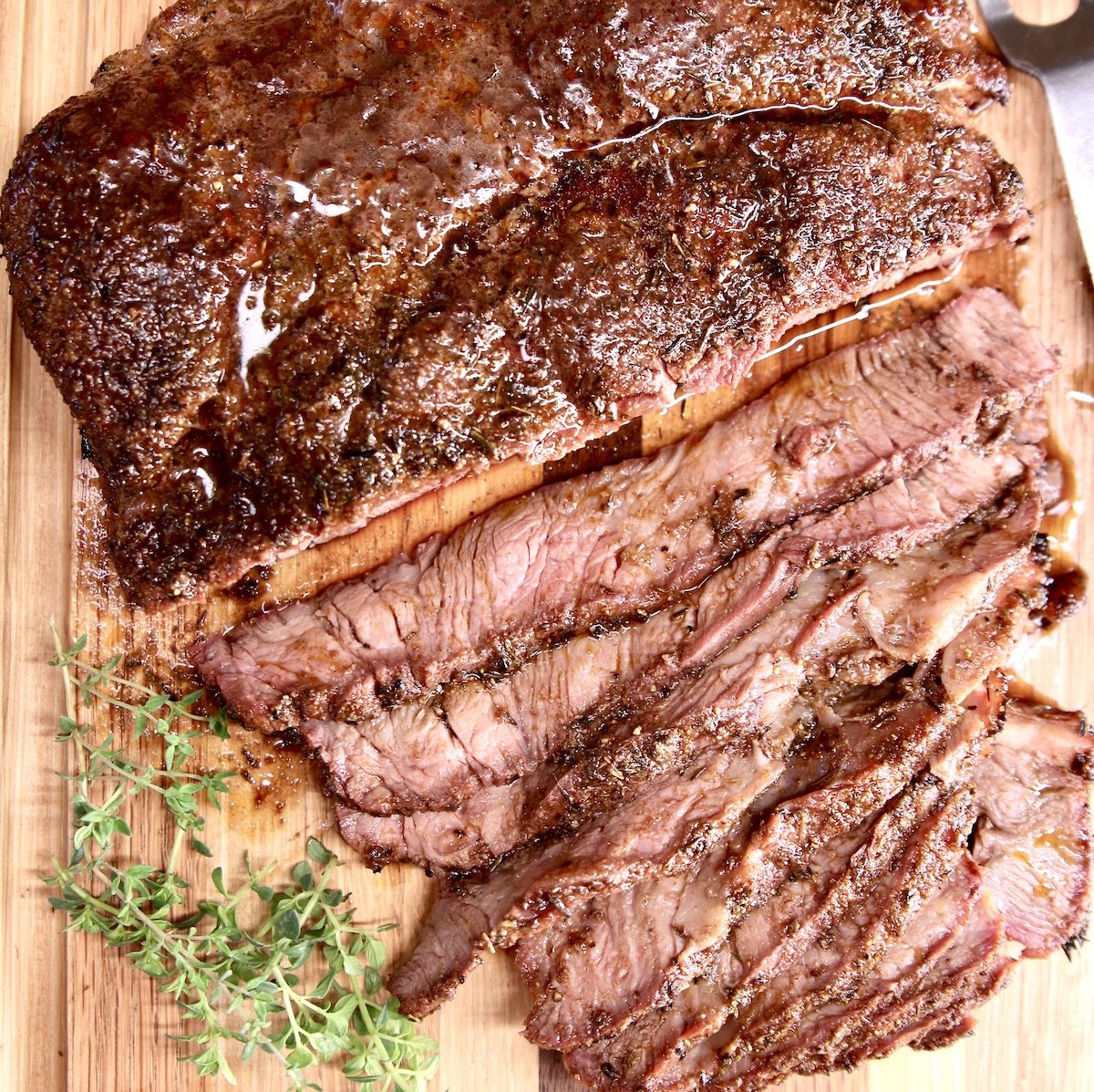 Image of premium highland beef, boneless chuck roast, cooked with thyme